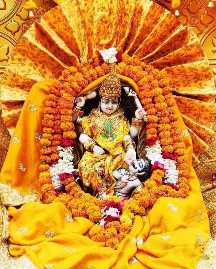 Close-up of a deity's eyes with intricate decorations